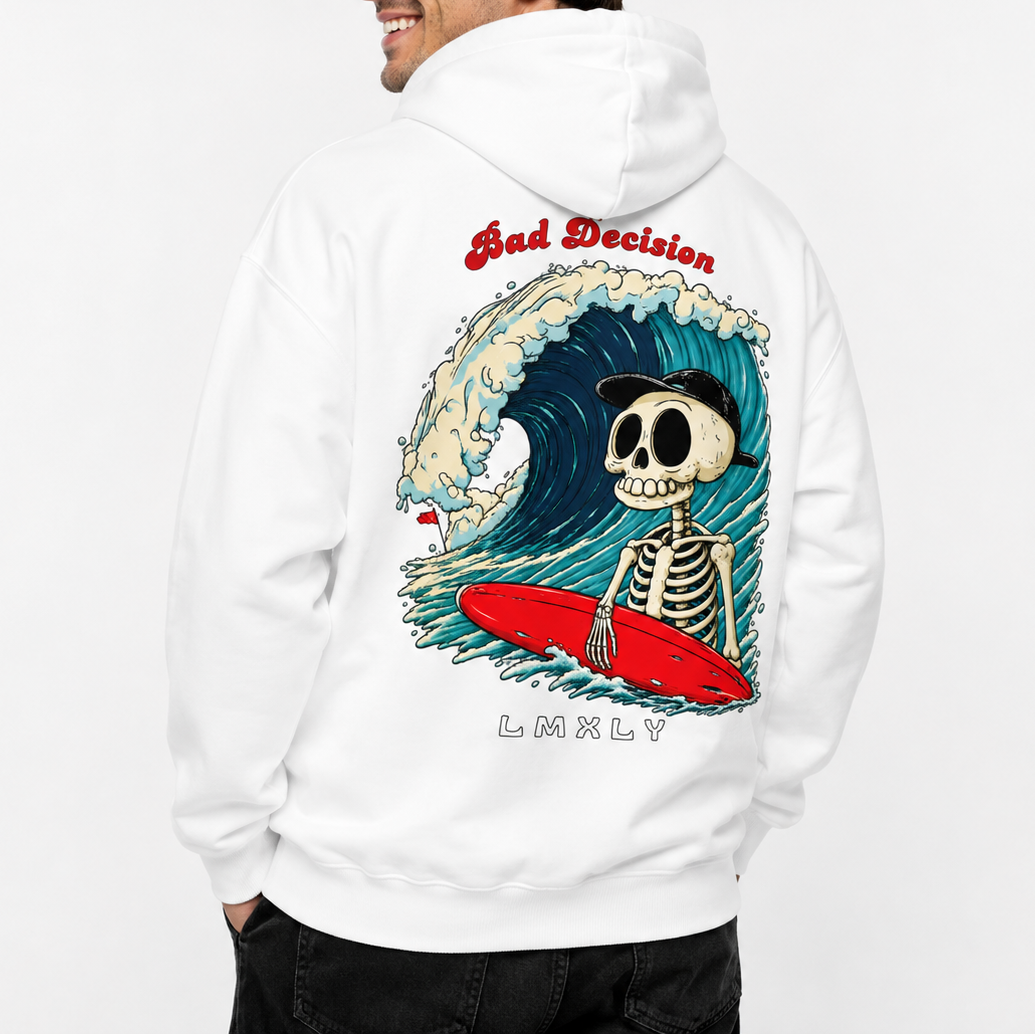 A man wearing a white hoodie, shown from the back. The hoodie features a large graphic print of a skeleton surfing on a red surfboard inside a blue wave, with the text 'Bad Decision' above and 'LMXLY' below.