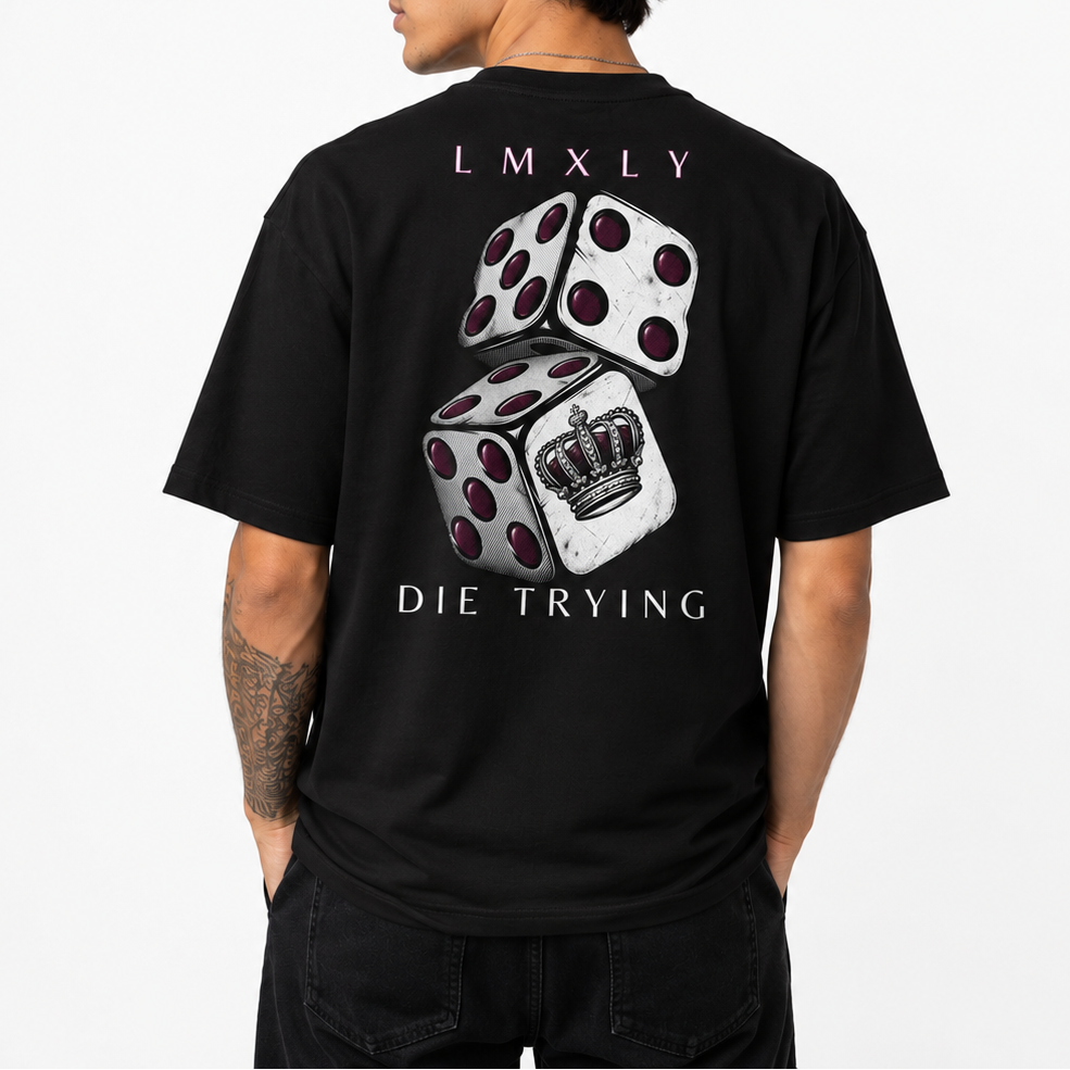A man shown from the back wearing a black t-shirt with a graphic print of two dice and a crown, with the text 'LMXLY' and 'DIE TRYING'.