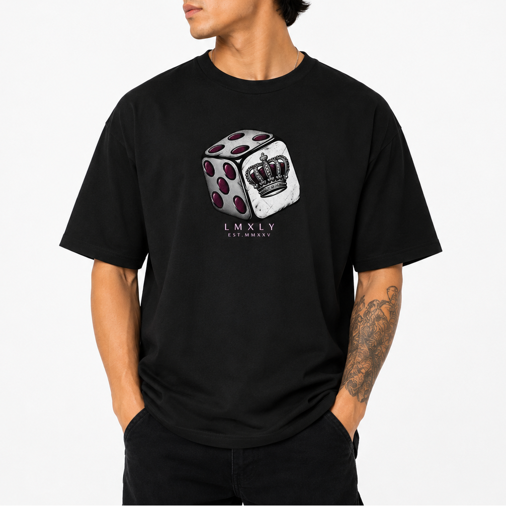 A man wearing a black crewneck t-shirt with a graphic of a white die with red pips and a crown, and the text 'LMXLY' printed below, against a plain white background.