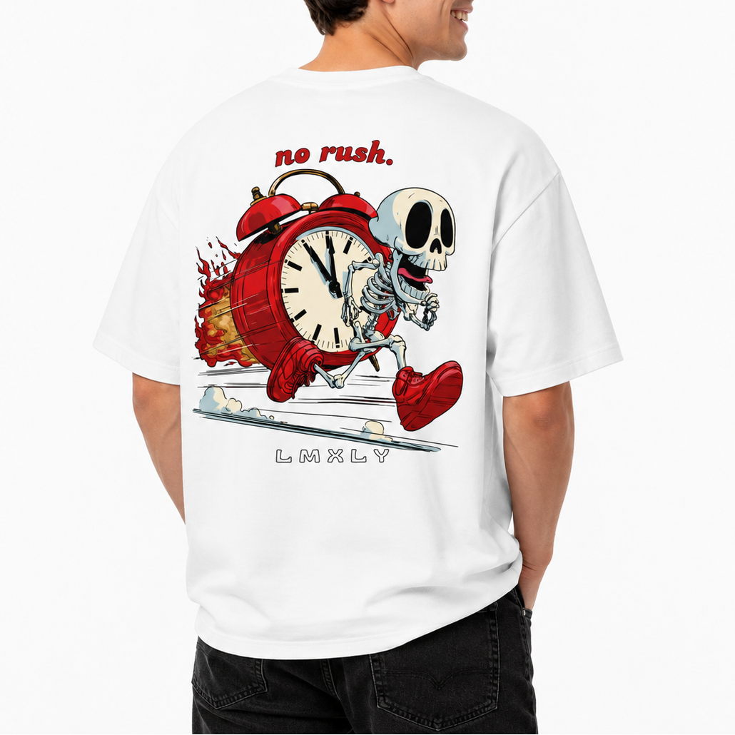 A man wearing a white graphic t-shirt, viewed from the back. The shirt features a cartoon illustration of a skeleton running alongside a red alarm clock, with the text 'no rush.